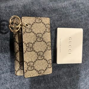 New condition Gucci key holder with original care card